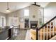 Stylish living room with high ceilings, a fireplace, and elegant decor at 9094 W 103Rd Ave, Broomfield, CO 80021