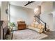 Cozy living room with a fireplace, a stylish couch, and hardwood floors at 9094 W 103Rd Ave, Broomfield, CO 80021