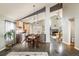 Open-concept living and dining area featuring vaulted ceilings and hardwood floors at 9094 W 103Rd Ave, Broomfield, CO 80021