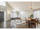 Bright living room showcasing hardwood floors, high ceilings, and natural light at 9094 W 103Rd Ave, Broomfield, CO 80021