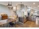 Living area with seamless view of Kitchen and dining area, and hardwood floors at 9094 W 103Rd Ave, Broomfield, CO 80021