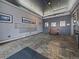 Neutral-colored lobby featuring mailboxes, slate tile flooring, artwork, and a small wooden bench at 2020 Arapahoe St # 1150, Denver, CO 80205