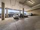 Spacious parking garage with multiple parking spots available and an open view of the cityscape at 2020 Arapahoe St # 1150, Denver, CO 80205