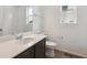 Bright bathroom featuring tile floors, a white quartz countertop, and a dark vanity at 6625 N Nepal St, Aurora, CO 80019