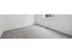 Empty bedroom featuring neutral carpet, a window with blinds, and white walls at 6625 N Nepal St, Aurora, CO 80019