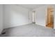 Spacious bedroom with carpet and a doorway leading to the Primary bathroom at 6625 N Nepal St, Aurora, CO 80019