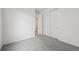 Carpeted bedroom featuring a closet with sliding doors and white walls at 6625 N Nepal St, Aurora, CO 80019