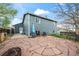 Large backyard patio perfect for entertaining or relaxing, with an outdoor umbrella providing shade on sunny days at 8896 W Teton Cir, Littleton, CO 80128