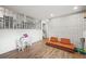 Finished basement area with play table, lounge sofa and decorative wallpaper at 8896 W Teton Cir, Littleton, CO 80128