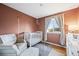 Cozy Bedroom with a neutral color palette, crib, armchair, and natural light at 8896 W Teton Cir, Littleton, CO 80128