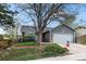 Attractive single Gathering home featuring mature trees, landscaping, and a well-maintained front yard at 8896 W Teton Cir, Littleton, CO 80128