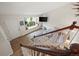 Bright living room showcasing stairs, window seat, and comfortable seating area at 8896 W Teton Cir, Littleton, CO 80128