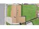 Aerial view of home with grass backyard, brown roof, and front driveway at 14441 Maxwell Pl, Denver, CO 80239