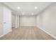 Finished basement area with neutral carpet, recessed lighting, and painted walls at 14441 Maxwell Pl, Denver, CO 80239
