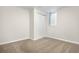 Bedroom featuring a neutral carpet, closet with sliding doors and a sunny window at 14441 Maxwell Pl, Denver, CO 80239