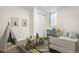 Staged bedroom with toys, a small table, and a closet with sliding doors at 14441 Maxwell Pl, Denver, CO 80239
