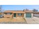 Charming front exterior of the home, featuring a well-maintained yard and a welcoming entrance at 14441 Maxwell Pl, Denver, CO 80239