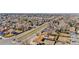 Aerial view showcases neighborhood streets with mature trees, and sidewalks at 14441 Maxwell Pl, Denver, CO 80239