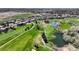 Expansive aerial view of the golf course, lakes, and housing in the community at 4373 E Phillips Pl, Centennial, CO 80122