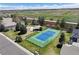 Aerial view of a tennis court and green space in a residential neighborhood on a sunny day at 4373 E Phillips Pl, Centennial, CO 80122