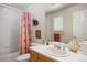 Well-lit bathroom featuring a shower-tub combination and a single sink vanity with white countertop at 4373 E Phillips Pl, Centennial, CO 80122