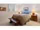 Bedroom featuring neutral colored walls, shuttered window, and coordinated decor at 4373 E Phillips Pl, Centennial, CO 80122