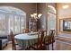Elegant dining room featuring hardwood floors, a chandelier, and natural light at 4373 E Phillips Pl, Centennial, CO 80122