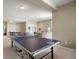 Spacious rec room with a ping pong table and comfortable seating area at 4373 E Phillips Pl, Centennial, CO 80122