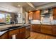 Gourmet kitchen with stainless steel appliances, tiled backsplash, and wooden cabinetry at 4373 E Phillips Pl, Centennial, CO 80122