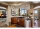 Open-concept kitchen featuring granite countertops and stainless steel dishwasher at 4373 E Phillips Pl, Centennial, CO 80122