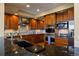 Gourmet kitchen with granite counters, stainless steel appliances, and custom cabinetry at 4373 E Phillips Pl, Centennial, CO 80122