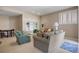 Cozy seating area in the living room with comfortable couches and a built-in bookshelf at 4373 E Phillips Pl, Centennial, CO 80122