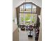 Bright living room with high ceilings, expansive windows overlooking the golf course, and comfortable seating at 4373 E Phillips Pl, Centennial, CO 80122
