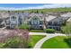 Rear exterior view featuring balconies, patios, and lush landscaping at 4373 E Phillips Pl, Centennial, CO 80122