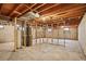 Unfinished basement with exposed wood framework, concrete flooring, and utility installations at 9004 E Floyd Ave, Denver, CO 80231