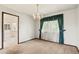 Inviting dining area with neutral carpet and decorative chandelier at 9004 E Floyd Ave, Denver, CO 80231