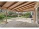 Covered outdoor patio with concrete flooring and view of backyard, perfect for entertaining at 9004 E Floyd Ave, Denver, CO 80231