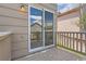 View of a wood deck with sliding glass door reflecting house across the yard at 2229 Hyacinth Rd, Highlands Ranch, CO 80129