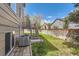 Fenced backyard with grass and a wooden deck with stairs at 2229 Hyacinth Rd, Highlands Ranch, CO 80129
