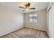 Bedroom with carpet, window, and closet for comfort and storage at 2229 Hyacinth Rd, Highlands Ranch, CO 80129