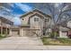 Two-story home featuring a two car garage and well-maintained lawn, with a blue sky at 2229 Hyacinth Rd, Highlands Ranch, CO 80129