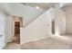 Foyer with staircase, neutral paint, carpet, tile flooring and views to other rooms at 2229 Hyacinth Rd, Highlands Ranch, CO 80129