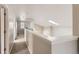 Bright hallway with carpet flooring and natural light from a skylight at 2229 Hyacinth Rd, Highlands Ranch, CO 80129