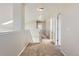 Bright upstairs hallway with carpet and lighting at 2229 Hyacinth Rd, Highlands Ranch, CO 80129