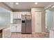 Charming kitchen featuring white cabinets, stainless steel appliances, and granite countertops at 2229 Hyacinth Rd, Highlands Ranch, CO 80129