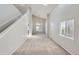 Bright living room featuring high ceilings, neutral paint, carpet and oversized windows at 2229 Hyacinth Rd, Highlands Ranch, CO 80129