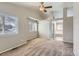 Spacious main bedroom with vaulted ceilings, large windows, and en-suite bathroom at 2229 Hyacinth Rd, Highlands Ranch, CO 80129