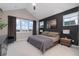 Bright main bedroom with high ceiling, large windows, and ensuite bath at 1465 Davis Ct, Erie, CO 80516