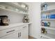 Walk-in pantry with white cabinets and shelves, providing ample storage space at 16070 Misty Rain Ct, Monument, CO 80132