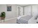 Cozy bedroom with soft carpet, a large window, and closet storage at 4750 E Louisiana Ave, Denver, CO 80246